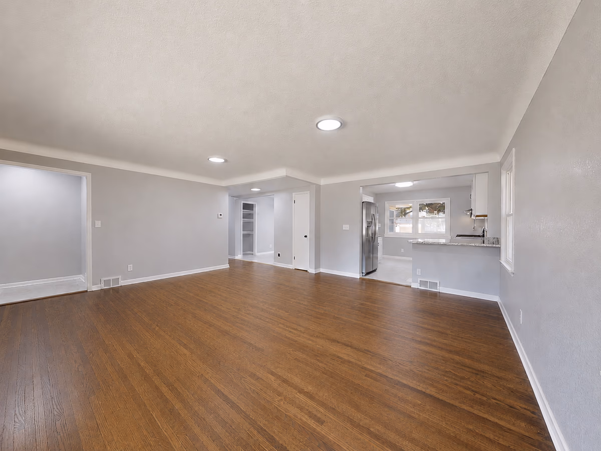 Empty home with clean hardwood floors prepared for moving